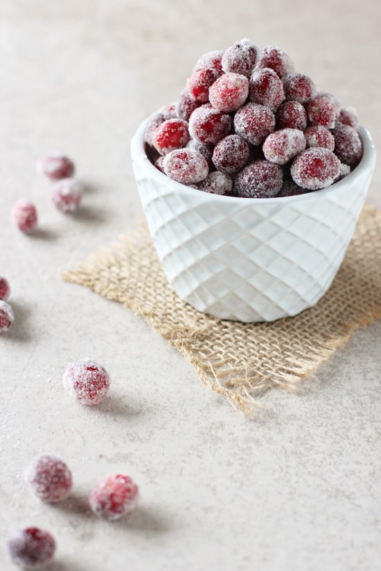 Spiced Sugared Cranberries in a white bowl.