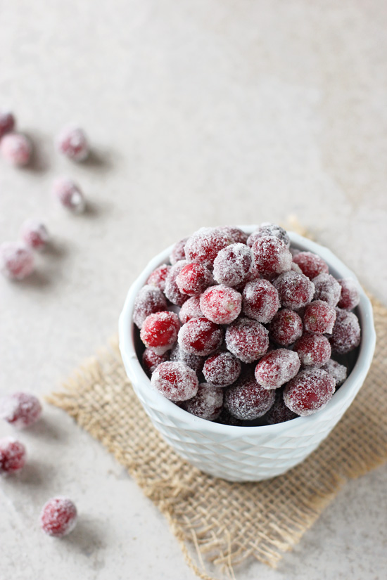 A white bowl filled with Homemade Sugared Cranberries.
