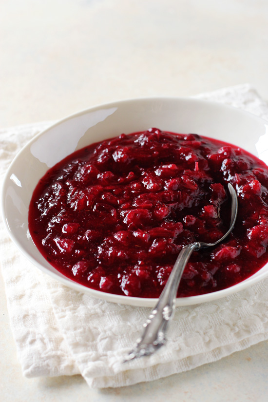 A white bowl filled with Vanilla Cranberry Sauce.