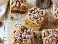 Recipe for a fall pumpkin apple crumb cake! With a soft pumpkin cake, sliced apples and a thick layer of crumbs! Made with coconut oil!