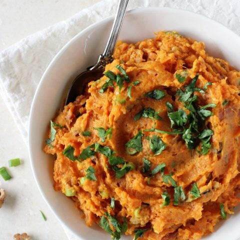 Recipe for savory mashed sweet potatoes! Perfect for thanksgiving or colder weather! Filled with green onion, parmesan, walnuts and a touch of cilantro!