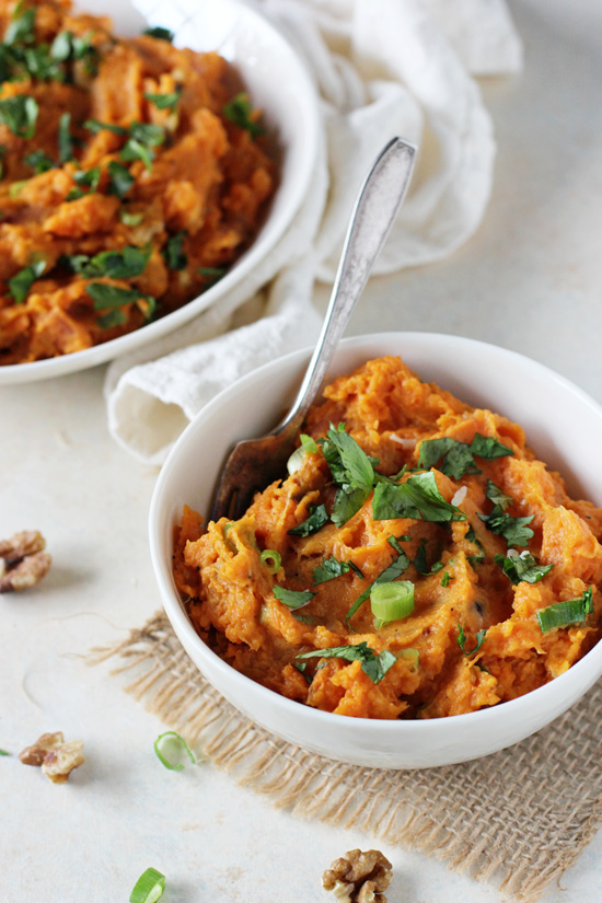 Two bowls filled with Savory Mashed Sweet Potatoes.