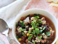 Recipe for easy slow cooker vegetarian tortilla soup! Filled with veggies, beans and plenty of spices! Serve with lots of fun toppings!