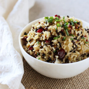 Recipe for an easy, flavorful wild rice pilaf. With shallots, apple, dried cranberries and pistachios! Perfect for everyday or the holidays!