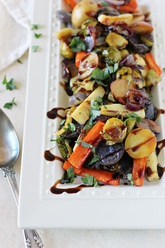A white serving platter with Honey Balsamic Roasted Veggies.