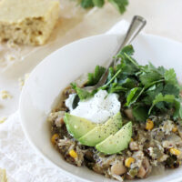 A healthy and protein packed slow cooker green chicken chili recipe! Filled with quinoa, white beans, peppers and salsa verde! So easy to make!