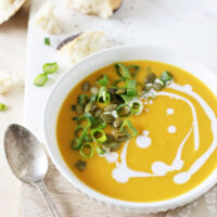 A simple, creamy and flavorful recipe for butternut squash soup! With thai-inspired flavors like ginger, coconut milk and roasted garlic!
