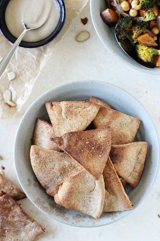 A grey dish filled with homemade pita chips.