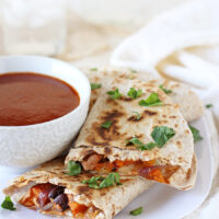 Plenty of veggies, spices, black beans and of course cheese make these roasted vegetable quesadillas a weeknight staple! A simple vegetarian recipe that can double as an appetizer!