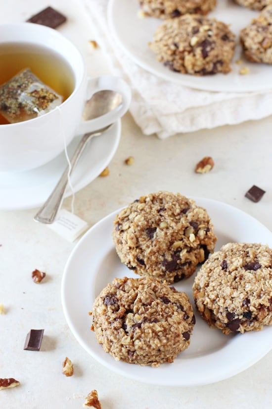 A white plate with three Banana Oat Breakfast Cookies with more cookies in the background.