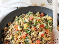 Healthy and easy pineapple cashew quinoa fried rice! Sweet, savory and packed with protein from the quinoa! On the table in about 30 minutes!