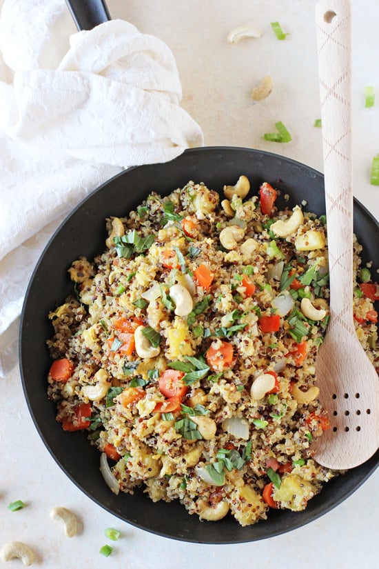 Overhead view of a black skillet filled with Quinoa Fried Rice.