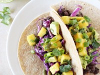 Simple and healthy black bean tacos with mango salsa! With smoky black beans, a sweet mango salsa and crunchy red cabbage! Colorful and fresh!