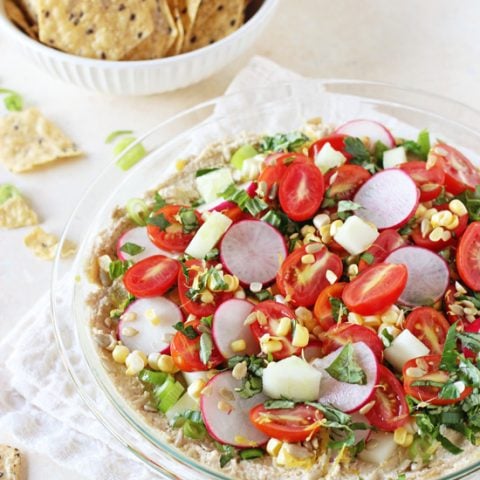 Healthy and easy garden veggie hummus dip! Colorful, super fresh and filled with a variety of summer veggies and herbs! A hit for any party!