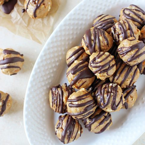 Crazy easy peanut butter pretzel honey balls! Sweet, salty and made with just six simple ingredients! Including a dark chocolate drizzle!