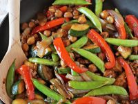 A simple, 30-minute bell pepper, snap pea and zucchini stir-fry that is perfect for summer! Filled with walnuts, basil and so much healthier than take-out!