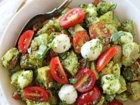 Fresh and fun, this caprese pesto potato salad is perfect for summer BBQs and picnics! Filled with yukon potatoes, kale pesto and no mayo in sight!