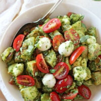 Fresh and fun, this caprese pesto potato salad is perfect for summer BBQs and picnics! Filled with yukon potatoes, kale pesto and no mayo in sight!
