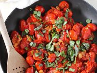 Packed with fresh basil, this simple fresh cherry tomato sauce is a perfect summer recipe! Toss with pasta for a flavorful weeknight meal!