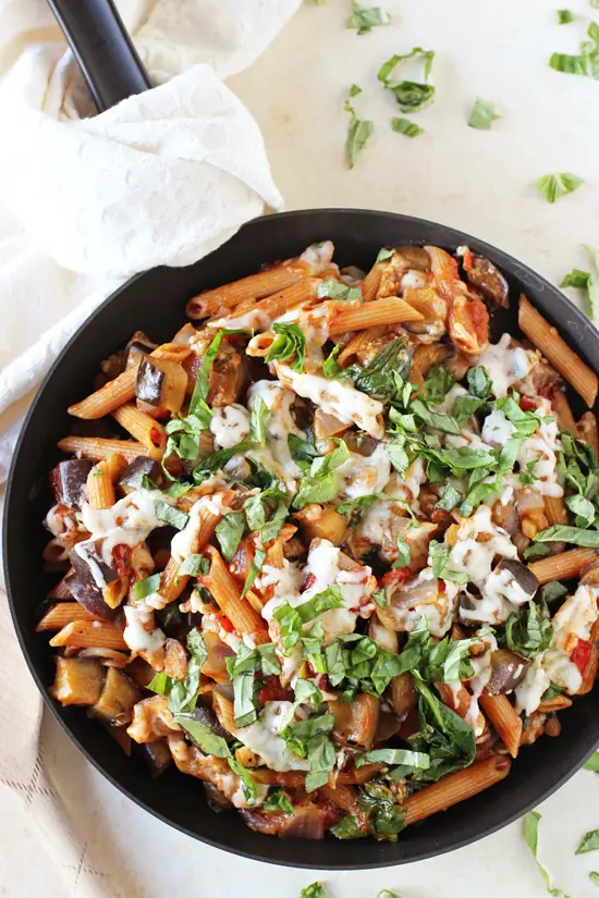 A black skillet filled with Eggplant Parmesan Pasta.