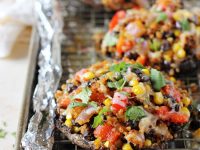 Filled with fresh veggies and black beans, these mexican quinoa stuffed portabella mushrooms are hard to resist! Topped with cheese and an herby avocado sauce!