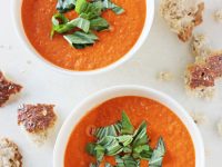 A creamy, healthy and homemade roasted cherry tomato soup! Serve topped with fresh basil and plenty of crusty bread!