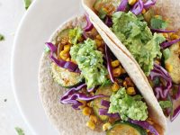 Just 30 minutes to these healthy and flavorful zucchini and corn tacos! With fresh corn, chili powder and a simple homemade guacamole!