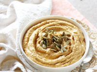 Creamy and cozy sweet potato hummus with roasted garlic! Healthy and packed with flavor, it makes an excellent appetizer or snack!
