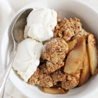 A simple apple cobbler with coconut oil biscuit topping! Made with whole wheat flour and coconut milk! Perfect when topped with vanilla ice cream. Dairy free & vegan!