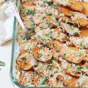 A healthier sweet potato gratin! Made with almond milk, shallots, cilantro and parmesan cheese! Comfy, cozy and no heavy cream in sight!
