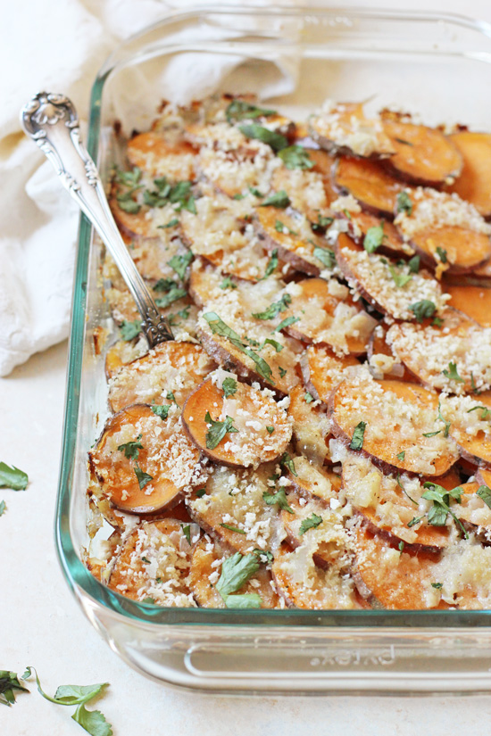 A glass baking dish filled with Healthy Sweet Potato Gratin.