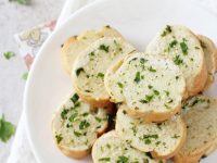 Easy, fast and delicious homemade freezer garlic bread! Have this crispy, herby and buttery bread ready to go whenever you need it!