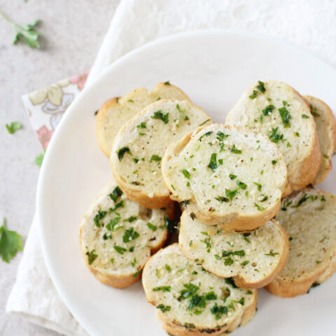 Easy, fast and delicious homemade freezer garlic bread! Have this crispy, herby and buttery bread ready to go whenever you need it!