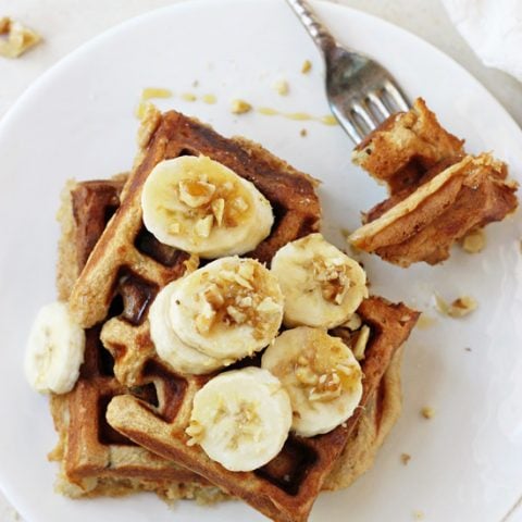 Light & filling healthy banana walnut waffles! These whole wheat waffles freeze beautifully, making them perfect for busy mornings!