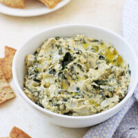 This healthy spinach artichoke hummus makes for a perfect appetizer or snack! It’s packed with flavor and only takes 15 minutes to whip up!