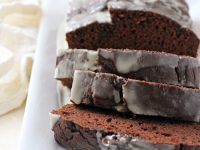 Wonderfully soft & moist chocolate sweet potato bread! Made with whole wheat flour, sweet potato puree & topped with a quick glaze!