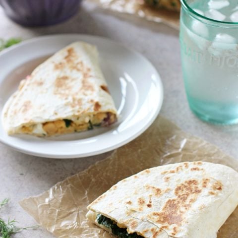 These greek chickpea quesadillas are a healthy and easy meal! Cheesy, crispy and filled with plenty of veggies! With homemade tzatziki for dunking!