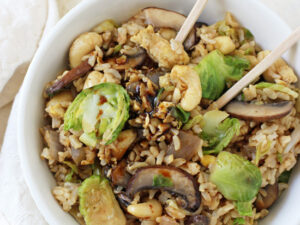 This healthy, easy and fast brussels sprout fried brown rice is hard to resist! Filled with mushrooms, cashews and of course, brussels sprouts!