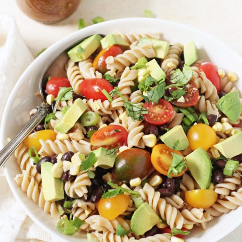 Fresh and fun vegetable taco pasta salad! Packed with veggies, herbs, whole wheat pasta and a creamy, dreamy dressing!
