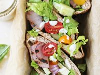 These simple grilled greek salad pita sandwiches make for a fantastic easy dinner! With a greek salad filling, grilled red onions and a creamy sauce for drizzling!