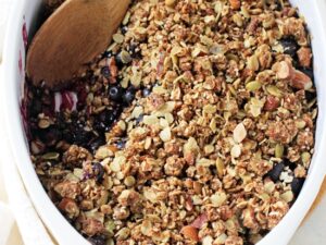 This easy blueberry breakfast crisp is a healthier spin on a classic dessert! Filled with juicy fresh berries and a granola-like topping!