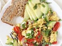 Simple, healthy and filling, this summer veggie egg scramble is perfect for breakfast or dinner! And it comes together in 25 minutes!