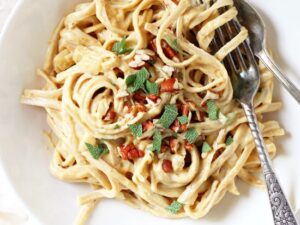 Dreamy, creamy whole wheat pumpkin fettuccine! Just 30 minutes to this healthier fall spin on classic alfredo! Dairy free, vegan and delicious!
