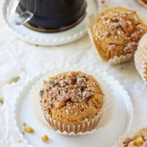 Soft and fluffy harvest sweet potato muffins! These simple muffins are filled with sweet potato puree, maple syrup, whole wheat flour and a crumb topping!