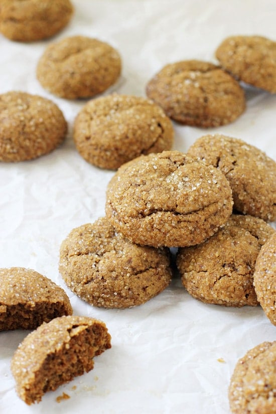 Soft & Chewy Whole Wheat Pumpkin Cookies scattered on crinkled parchment paper.