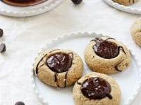 Irresistible chocolate peanut butter thumbprint cookies! With a soft peanut butter base, a chocolate peanut butter filling and a touch of flaky sea salt! Gluten-free & vegan!