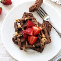 Perfectly light and fluffy chocolate whole wheat waffles! Easy, wholesome and a fantastic make-ahead breakfast! Just reheat in the toaster and go!