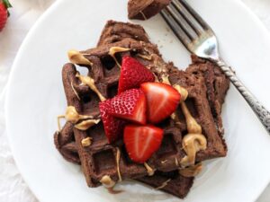 Perfectly light and fluffy chocolate whole wheat waffles! Easy, wholesome and a fantastic make-ahead breakfast! Just reheat in the toaster and go!
