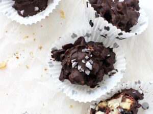 Dreamy dark chocolate, crunchy raw nuts and sweet dried cranberries combine in these irresistible dark chocolate fruit & nut clusters! An easy sweet & salty healthy treat!