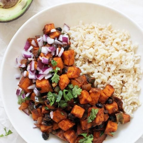 Just 35 minutes to this wholesome sweet potato & black bean enchilada stir-fry! Simple, packed with veggies and easy to customize to your taste!